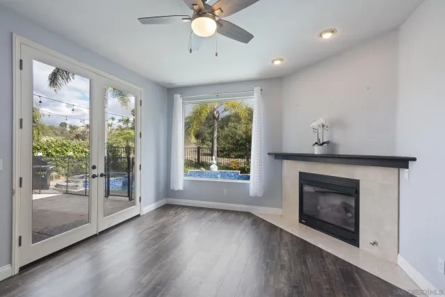 a kitchen with granite countertop white cabinets and stainless steel appliances
