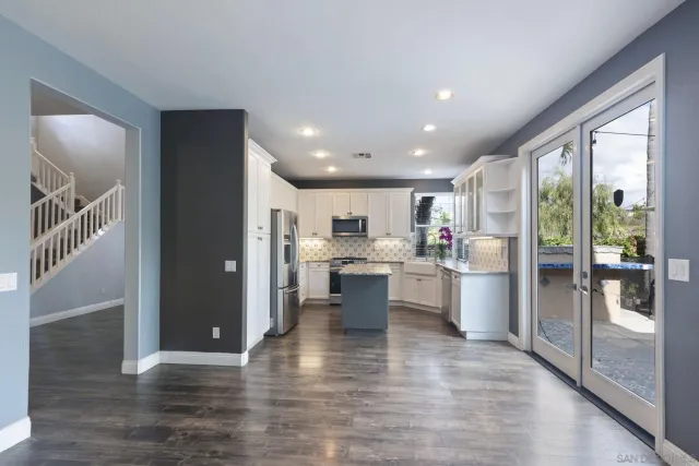a view of room with window wooden floor and ceiling fan