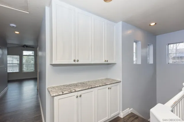 a bathroom with a glass door shower a sink and a mirror