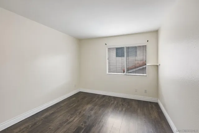 a view of a room with wooden fence