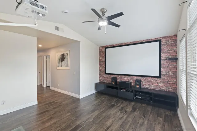 a view of a backyard with plants and outdoor seating