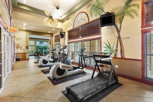 a view of a livingroom with furniture and a floor to ceiling window