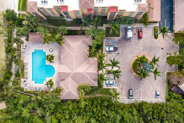 an aerial view of multiple houses with outdoor space