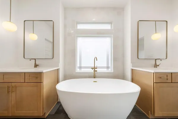 a bathroom with a bathtub and a sink