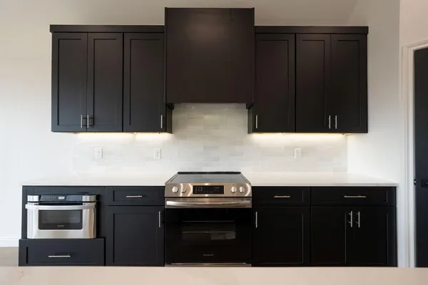 a kitchen with a sink and a stove