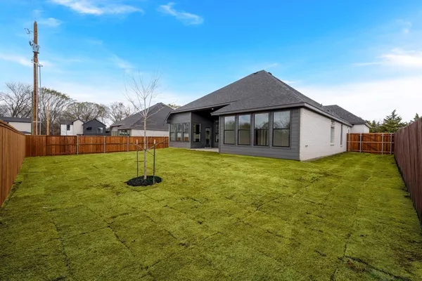 a house view with a garden space
