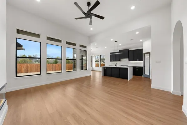a view of kitchen with furniture and wooden floor