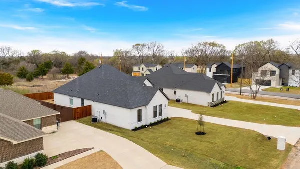 a view of a house with a big yard
