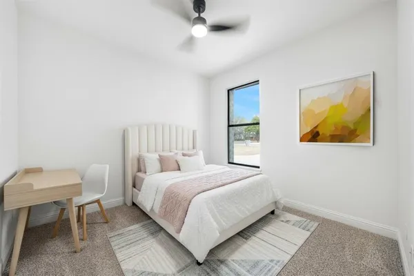 a bedroom with a bed and a table in it