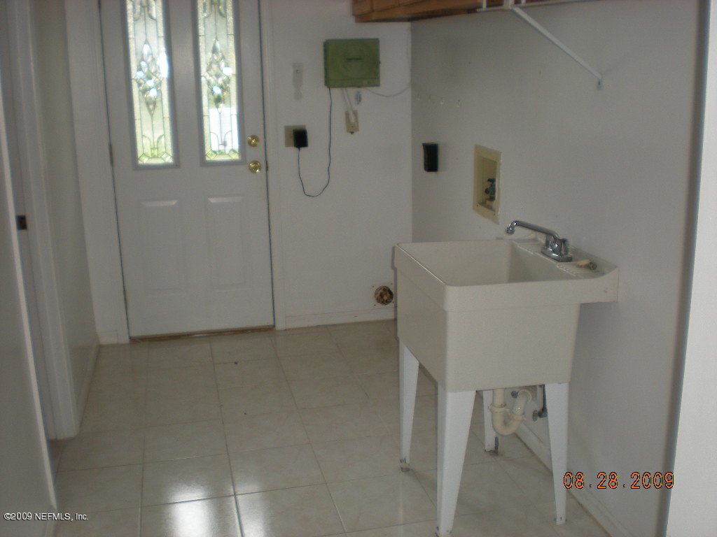 836 Orangewood Road St. Johns, FL 32259 - Photo 12 of 13 a bathroom with a sink and shower