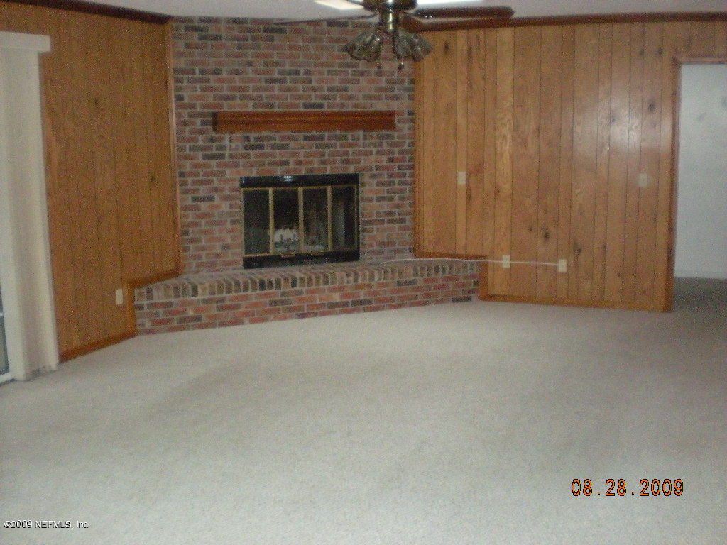 836 Orangewood Road St. Johns, FL 32259 - Photo 3 of 13 a view of empty room with a fireplace