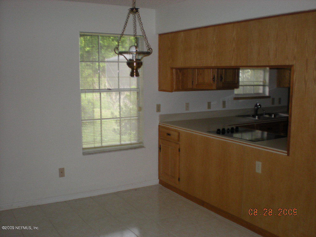 836 Orangewood Road St. Johns, FL 32259 - Photo 9 of 13 a kitchen with a sink and cabinets