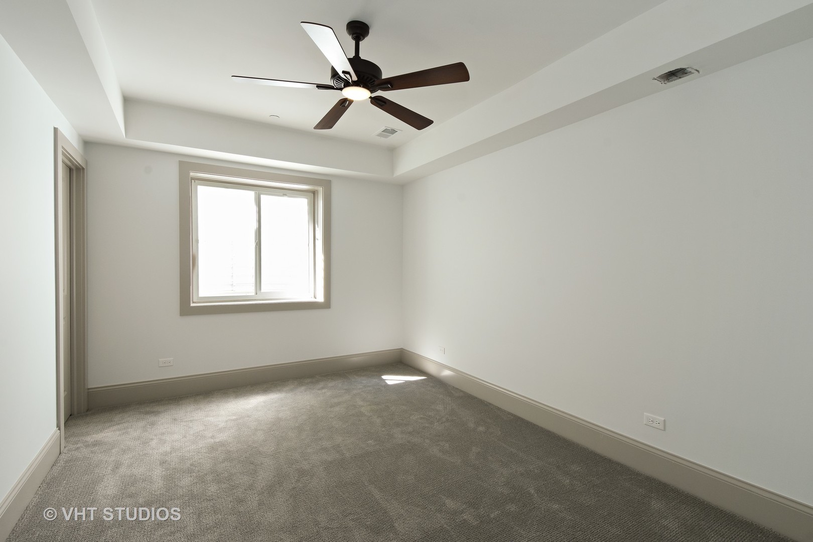 748 Prairie Avenue Barrington, IL 60010 - Photo 20 of 27 a view of a big room with a ceiling fan and windows