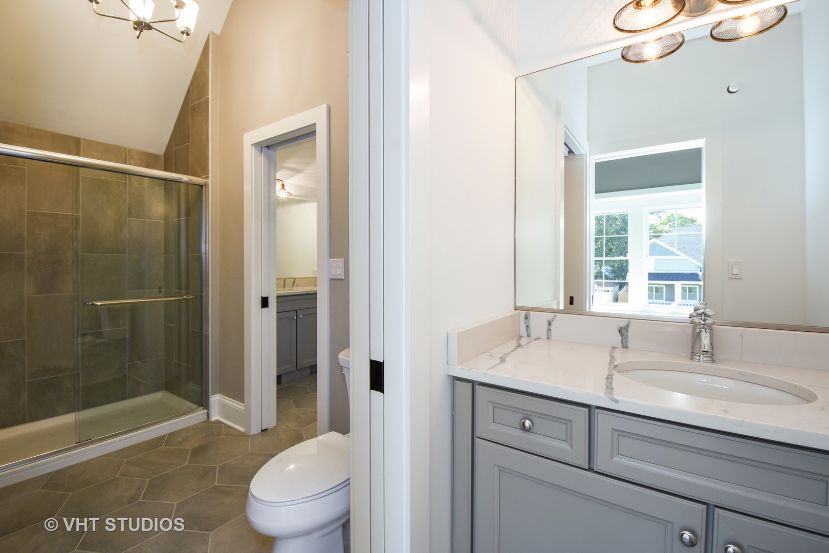 748 Prairie Avenue Barrington, IL 60010 - Photo 21 of 27 a bathroom with a sink a toilet and shower