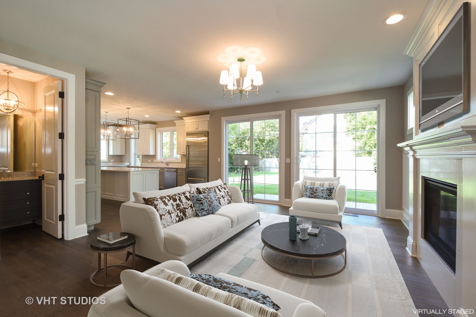 748 Prairie Avenue Barrington, IL 60010 - Photo 9 of 27 a living room with furniture a fireplace and a flat screen tv