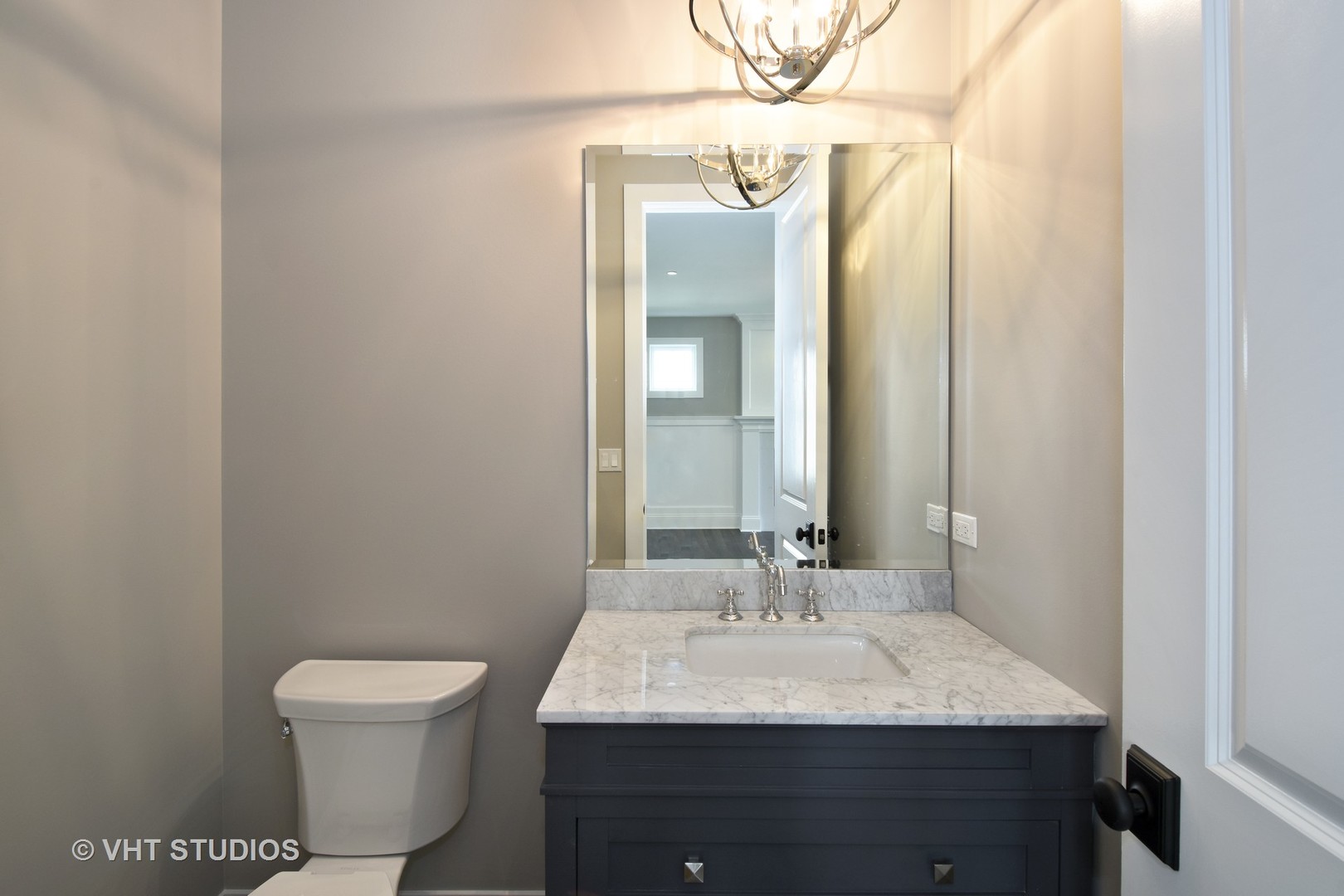 748 Prairie Avenue Barrington, IL 60010 - Photo 10 of 27 a bathroom with a toilet sink and mirror