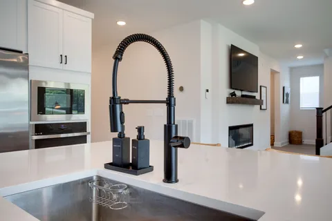 a view of living room with furniture and flat screen tv