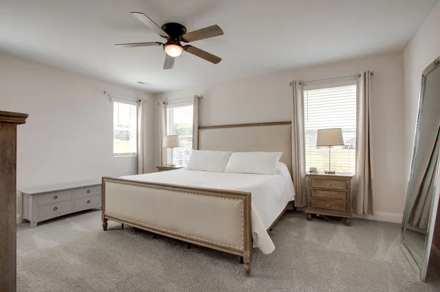 a bed room with a bed and a window