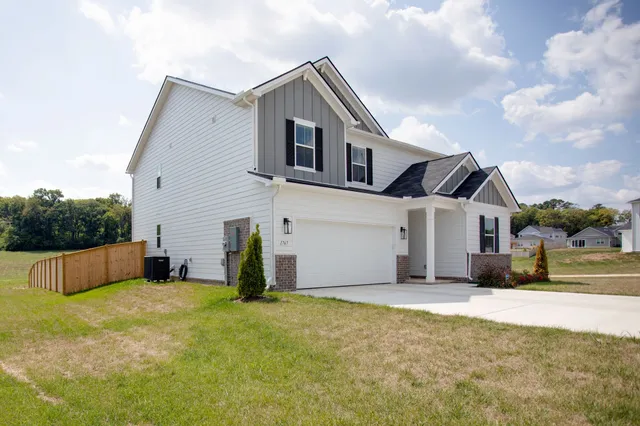 a front view of a house with yard