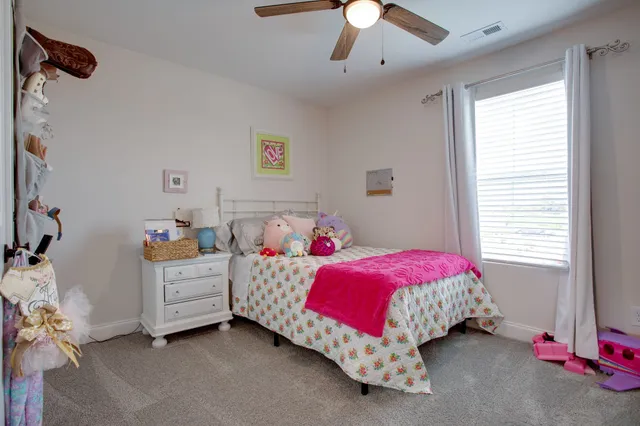 a bed room with a bed and a couch