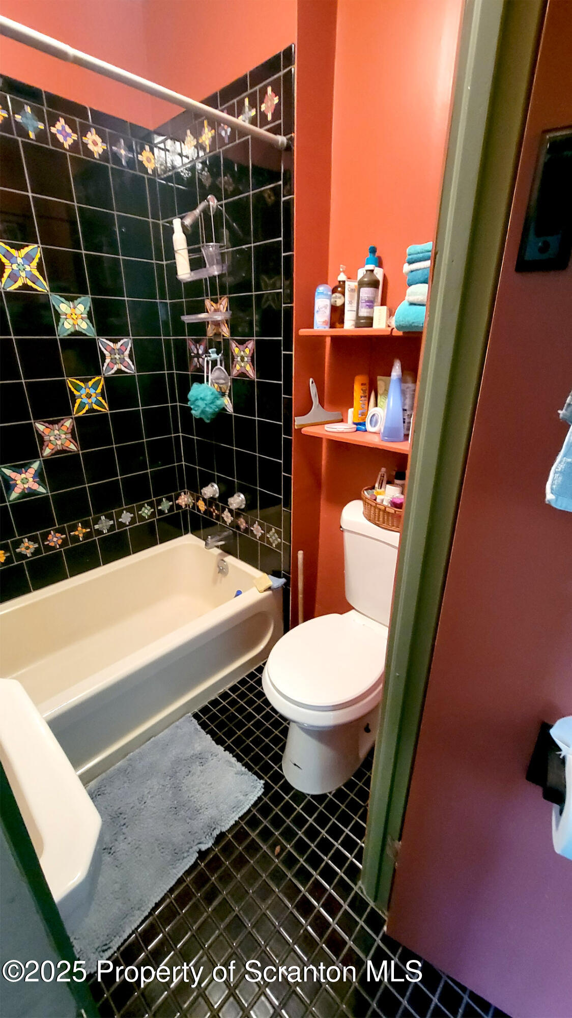 270 Starrucca Creek Road Starrucca, PA 18462 - Photo 13 of 51 a bathroom with a sink a toilet a mirror and shower