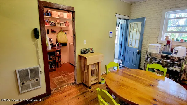 a bedroom with a bed and a dresser in it