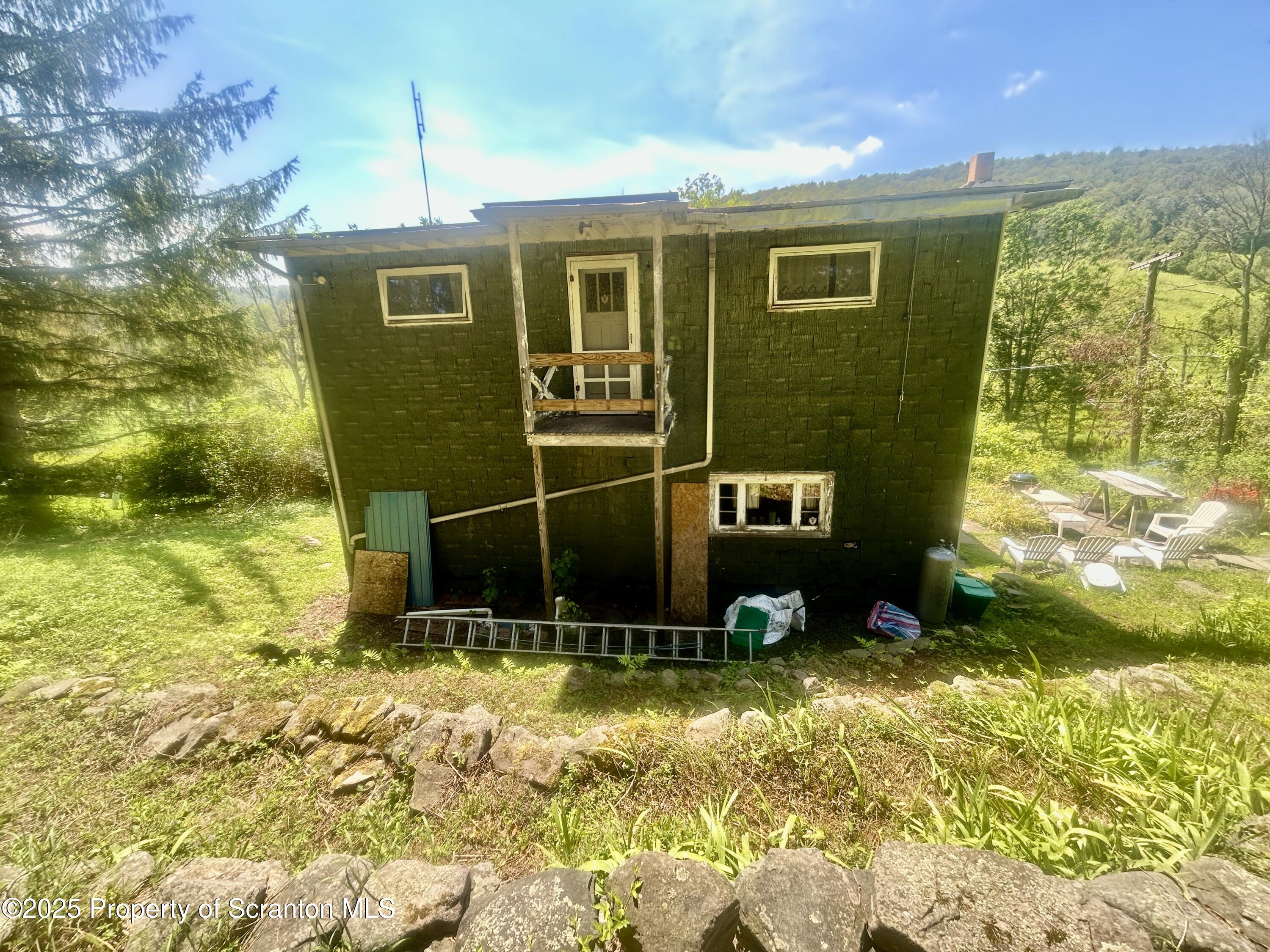 270 Starrucca Creek Road Starrucca, PA 18462 - Photo 34 of 51 a front view of a house with a yard