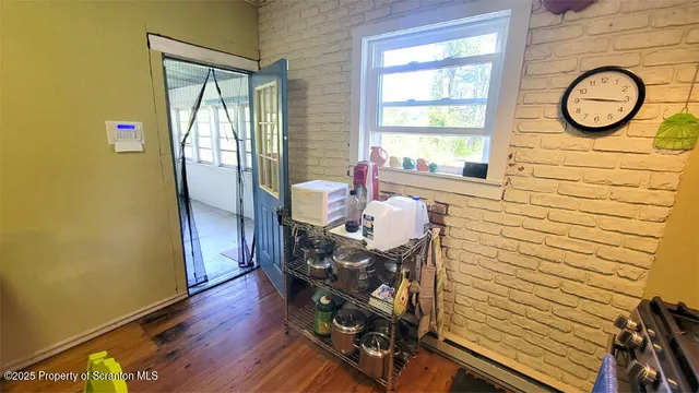 a bathroom with a sink a toilet a mirror and shower