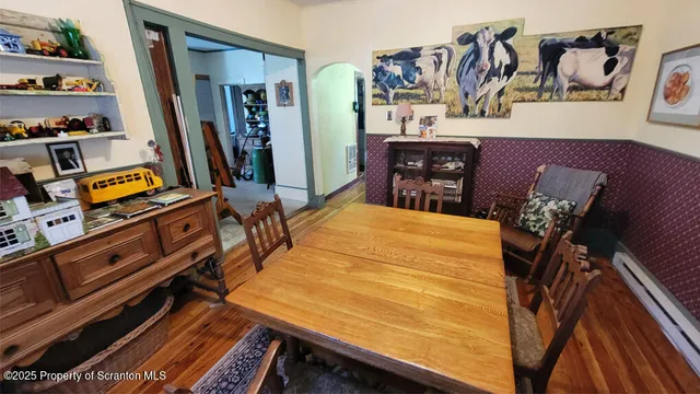 a bed sitting in a bedroom next to a lamp