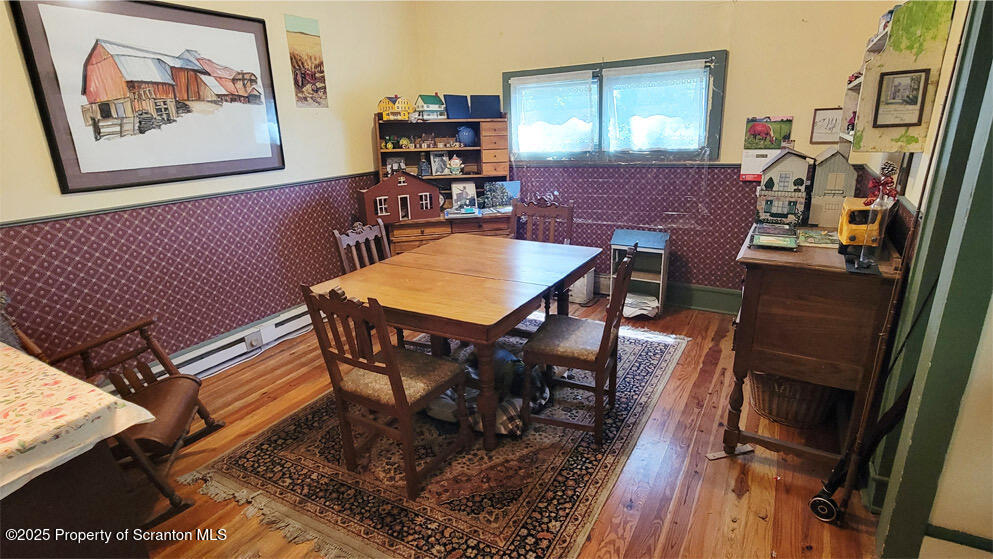 270 Starrucca Creek Road Starrucca, PA 18462 - Photo 6 of 51 a view of a dining room with furniture