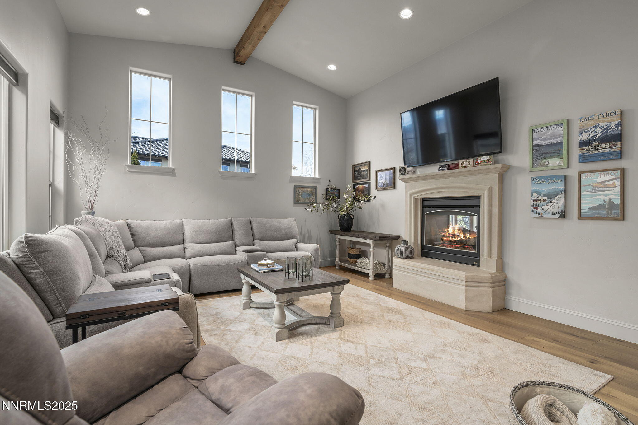 14220 Eagle Springs Court Reno, NV 89511 - Photo 13 of 57 a living room with furniture a fireplace and a flat screen tv
