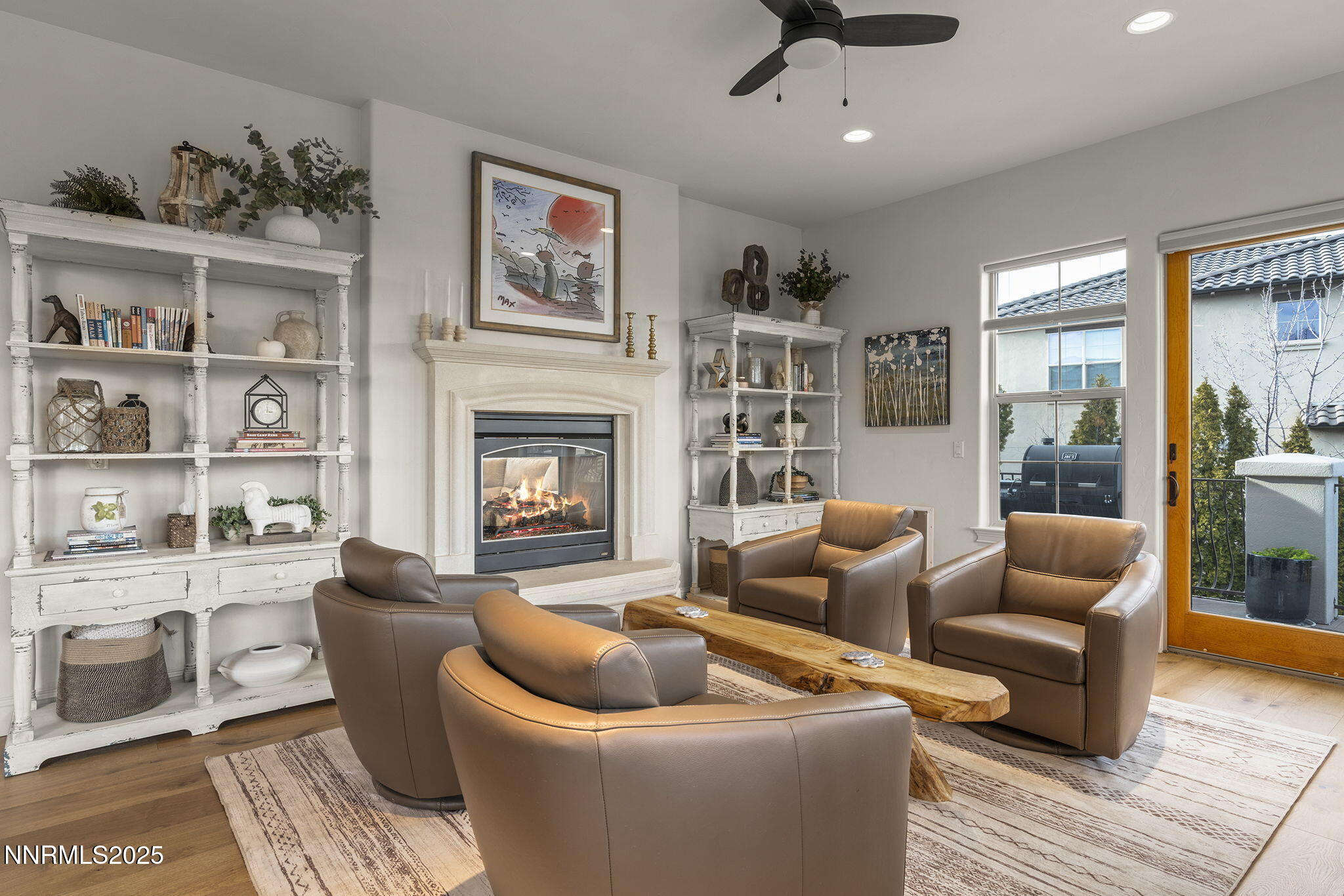 14220 Eagle Springs Court Reno, NV 89511 - Photo 22 of 57 a living room with furniture a rug and a fireplace