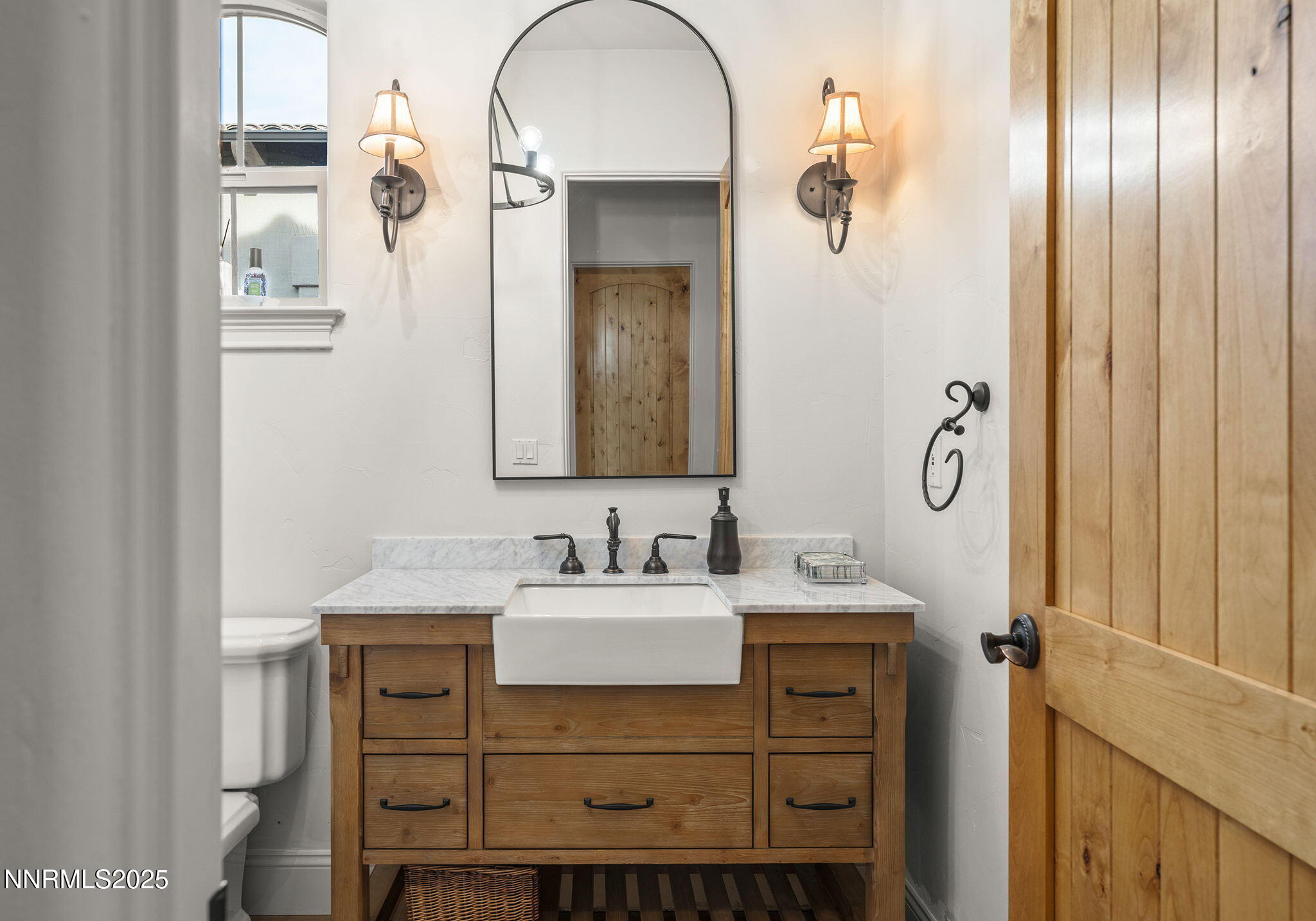 14220 Eagle Springs Court Reno, NV 89511 - Photo 26 of 57 a bathroom with a sink and a mirror
