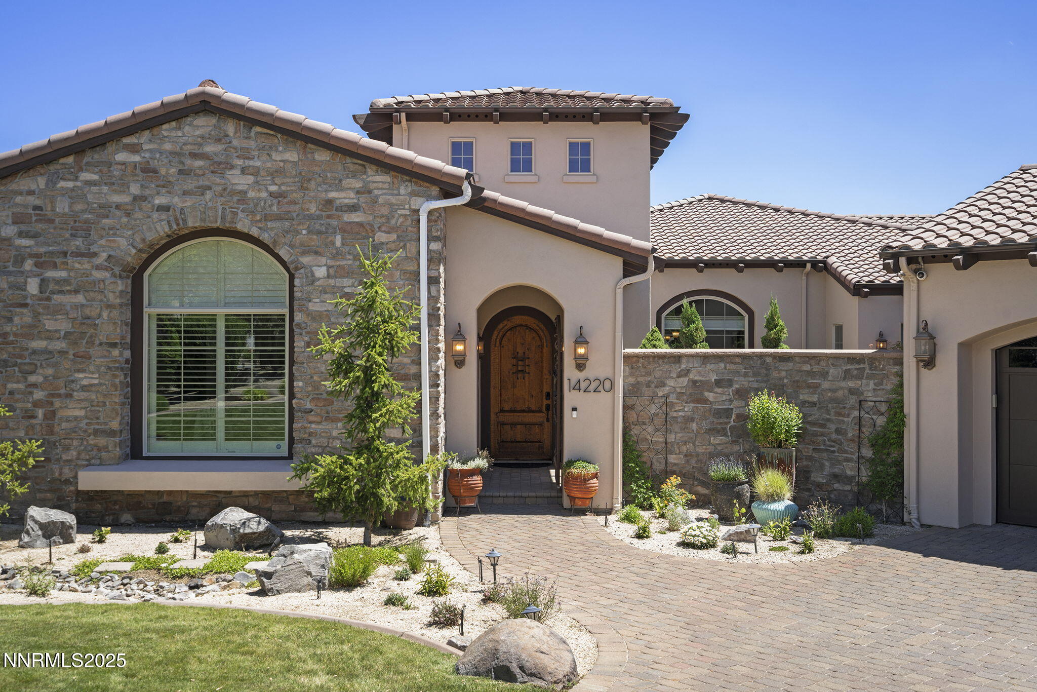 14220 Eagle Springs Court Reno, NV 89511 - Photo 3 of 57 a front view of a house with garden