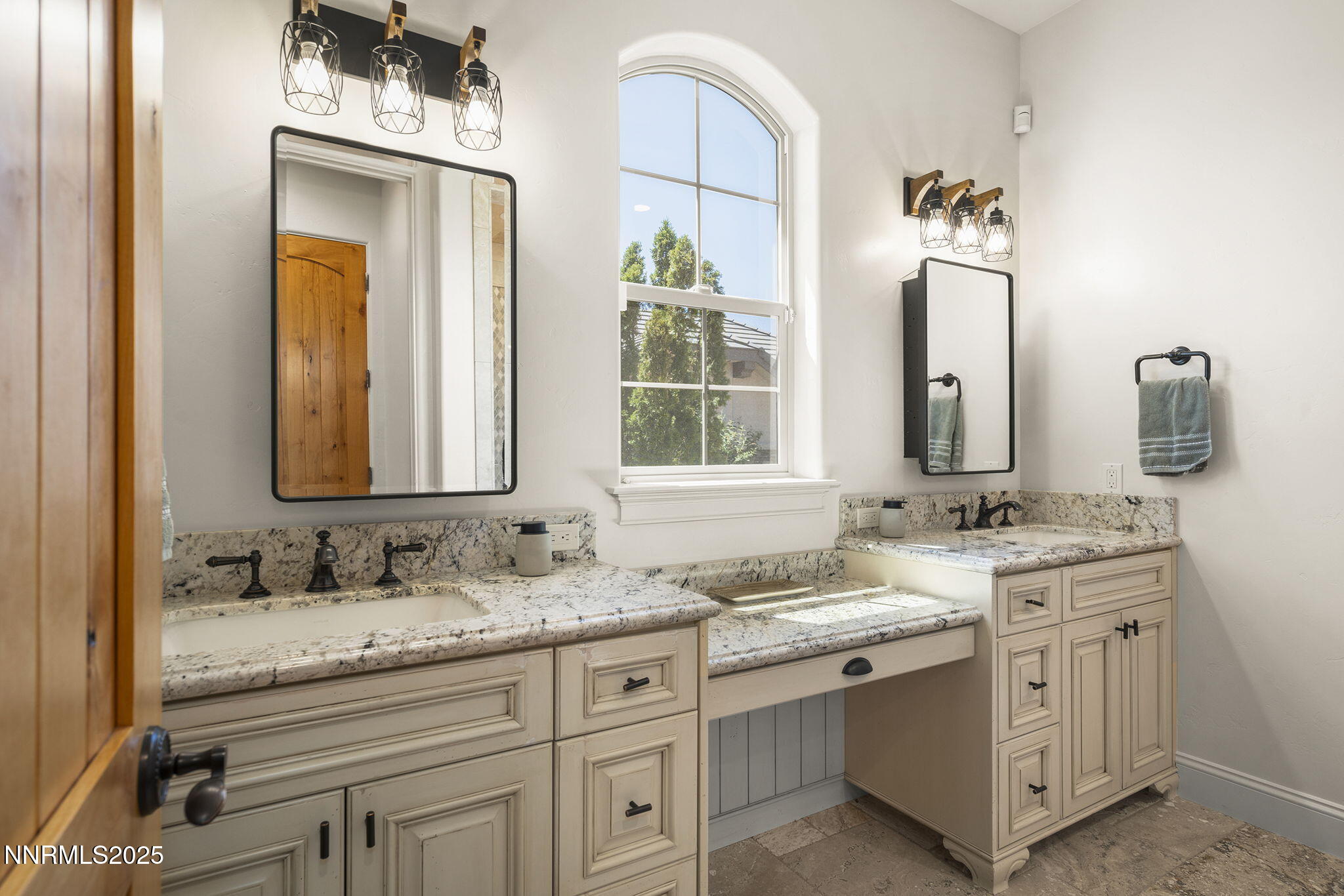 14220 Eagle Springs Court Reno, NV 89511 - Photo 36 of 57 a bathroom with a granite countertop sink and a mirror