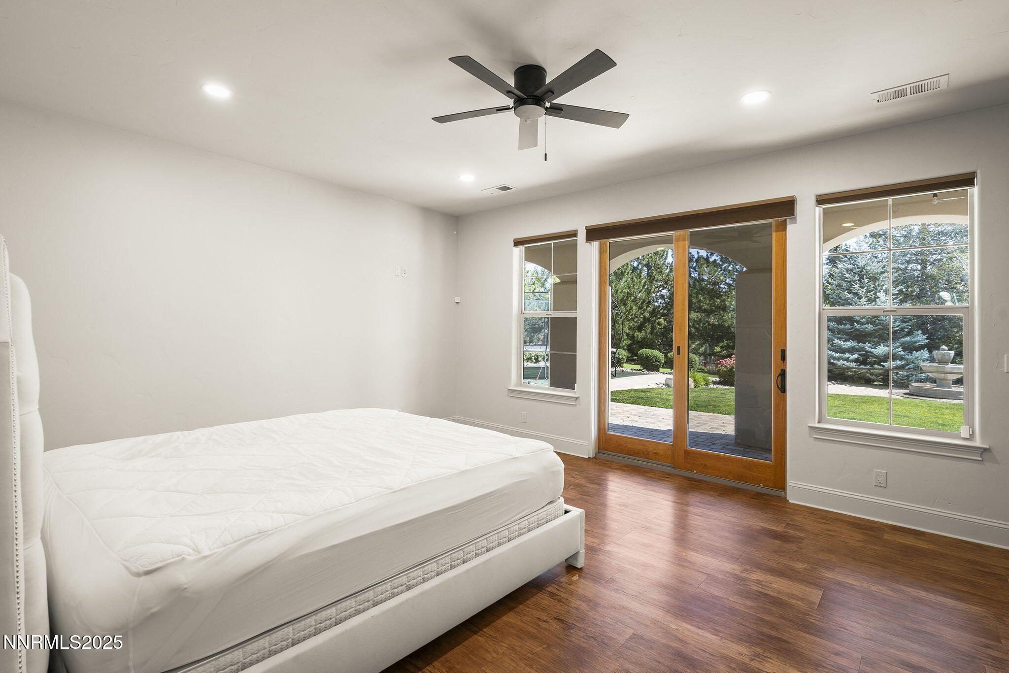 14220 Eagle Springs Court Reno, NV 89511 - Photo 42 of 57 a bedroom with a large bed and a large window