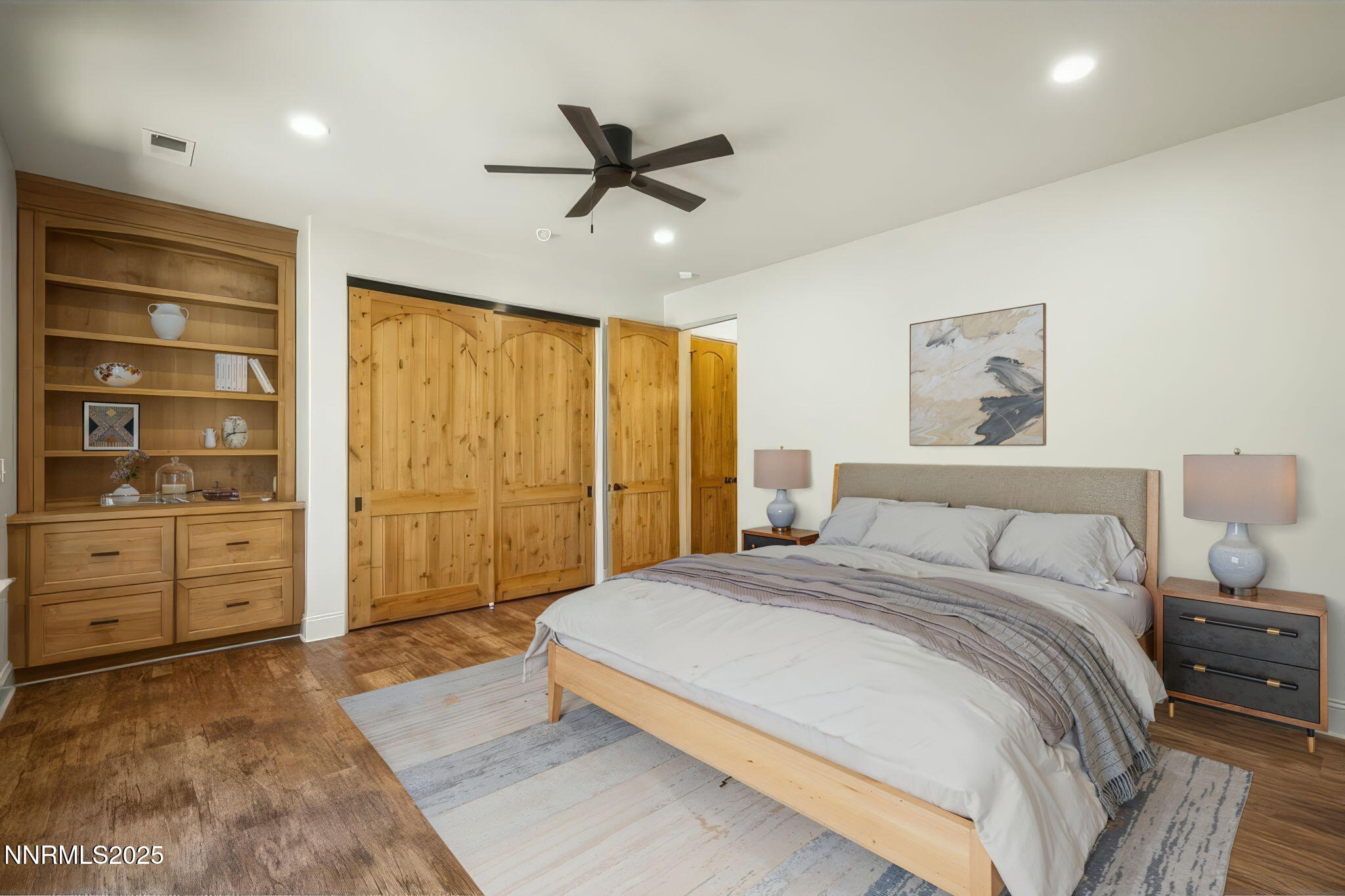 14220 Eagle Springs Court Reno, NV 89511 - Photo 43 of 57 a spacious bedroom with a bed and a ceiling fan