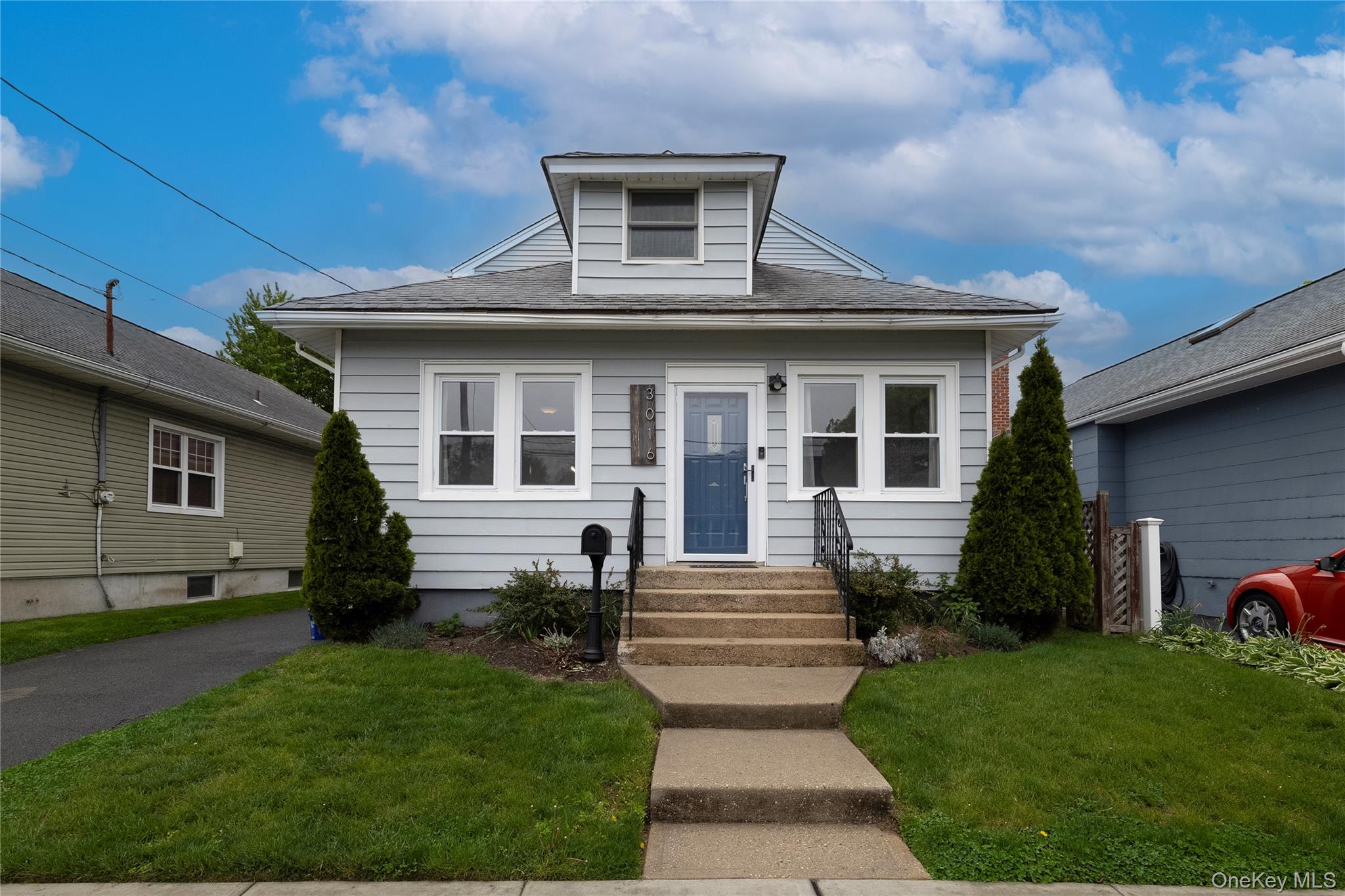 3016 Roxbury Road Oceanside, NY 11572 - Photo 1 of 24 a front view of a house with a yard