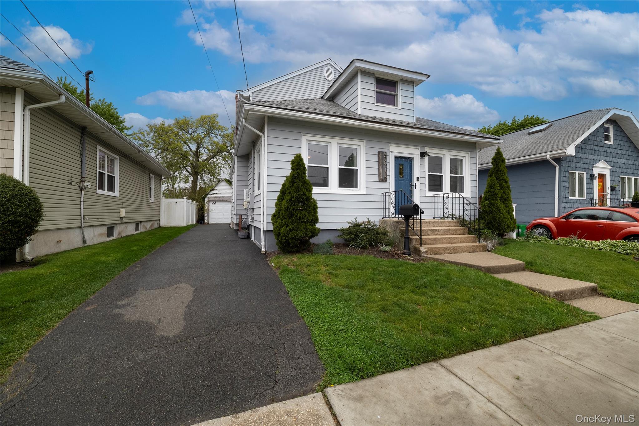 3016 Roxbury Road Oceanside, NY 11572 - Photo 2 of 24 a front view of a house with a yard