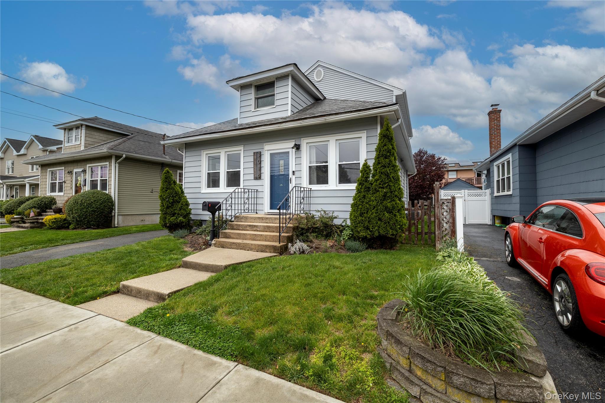 3016 Roxbury Road Oceanside, NY 11572 - Photo 3 of 24 a front view of a house with a yard