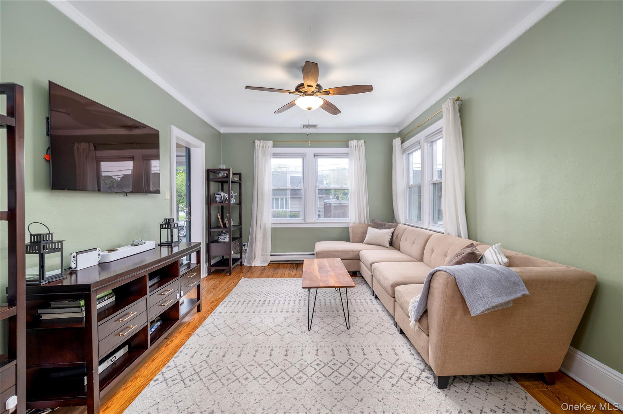 3016 Roxbury Road Oceanside, NY 11572 - Photo 5 of 24 a living room with furniture and a large window