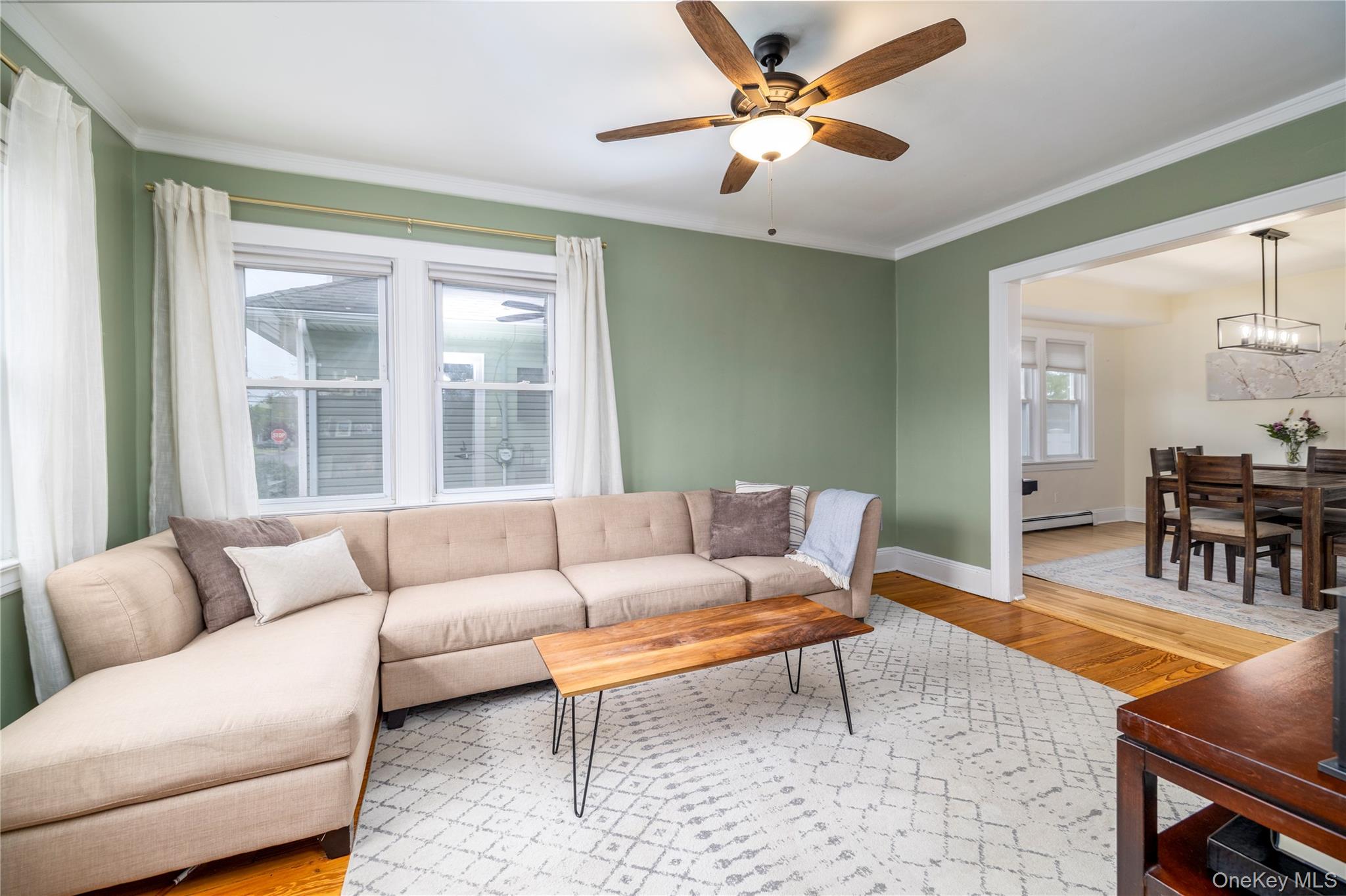 3016 Roxbury Road Oceanside, NY 11572 - Photo 6 of 24 a living room with furniture and a large window