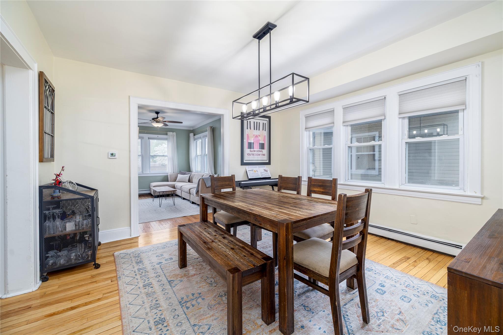 3016 Roxbury Road Oceanside, NY 11572 - Photo 8 of 24 a view of a dining room with furniture window and wooden floor