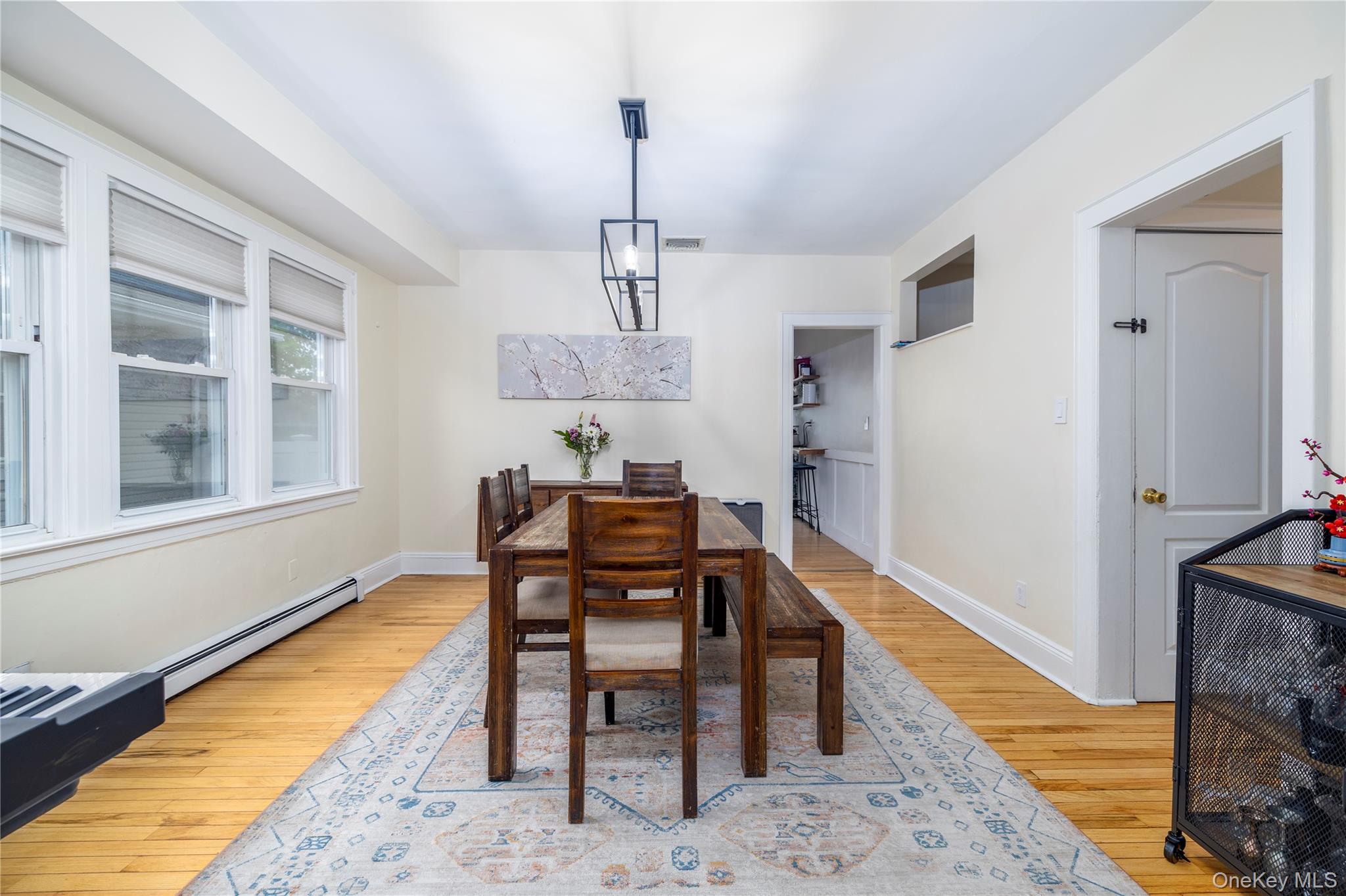 3016 Roxbury Road Oceanside, NY 11572 - Photo 9 of 24 a view of a dining room with furniture and wooden floor