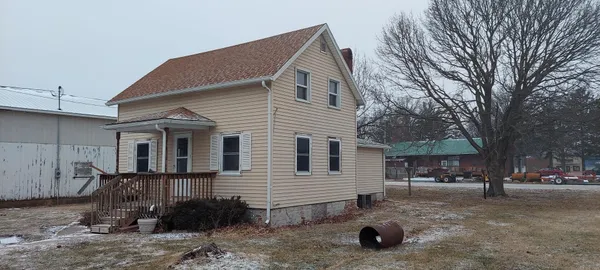 a view of a house with a yard