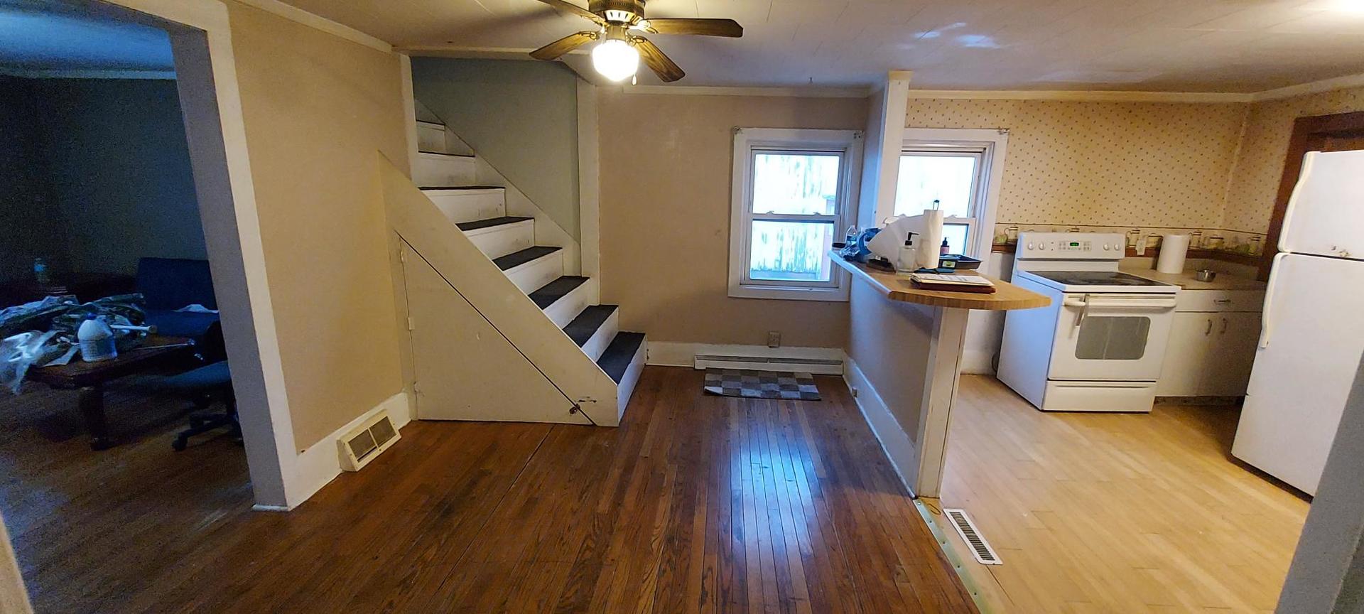 506 State Street New Windsor, IL 61465 - Photo 7 of 10 a living room with furniture and a wooden floor