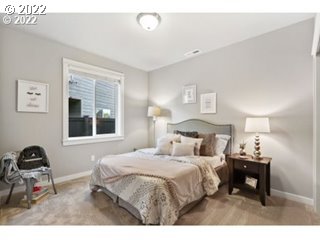5319 Squirrel Street Springfield, OR 97478 - Photo 5 of 7 a bedroom with a bed and a window