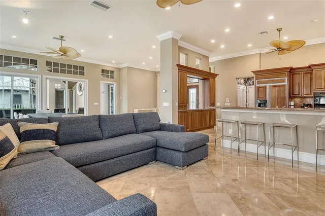 a view of a kitchen with a sink and refrigerator