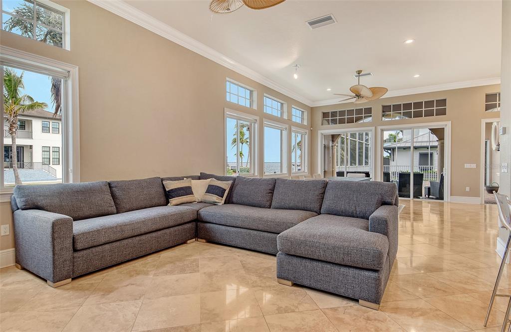 591 Putting Green Lane Longboat Key, FL 34228 - Photo 15 of 68 a living room with furniture and a large window