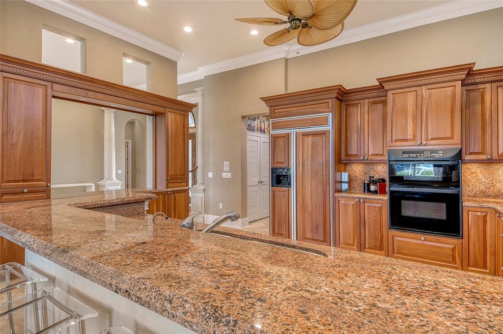 591 Putting Green Lane Longboat Key, FL 34228 - Photo 21 of 68 a view of a kitchen with a sink and refrigerator